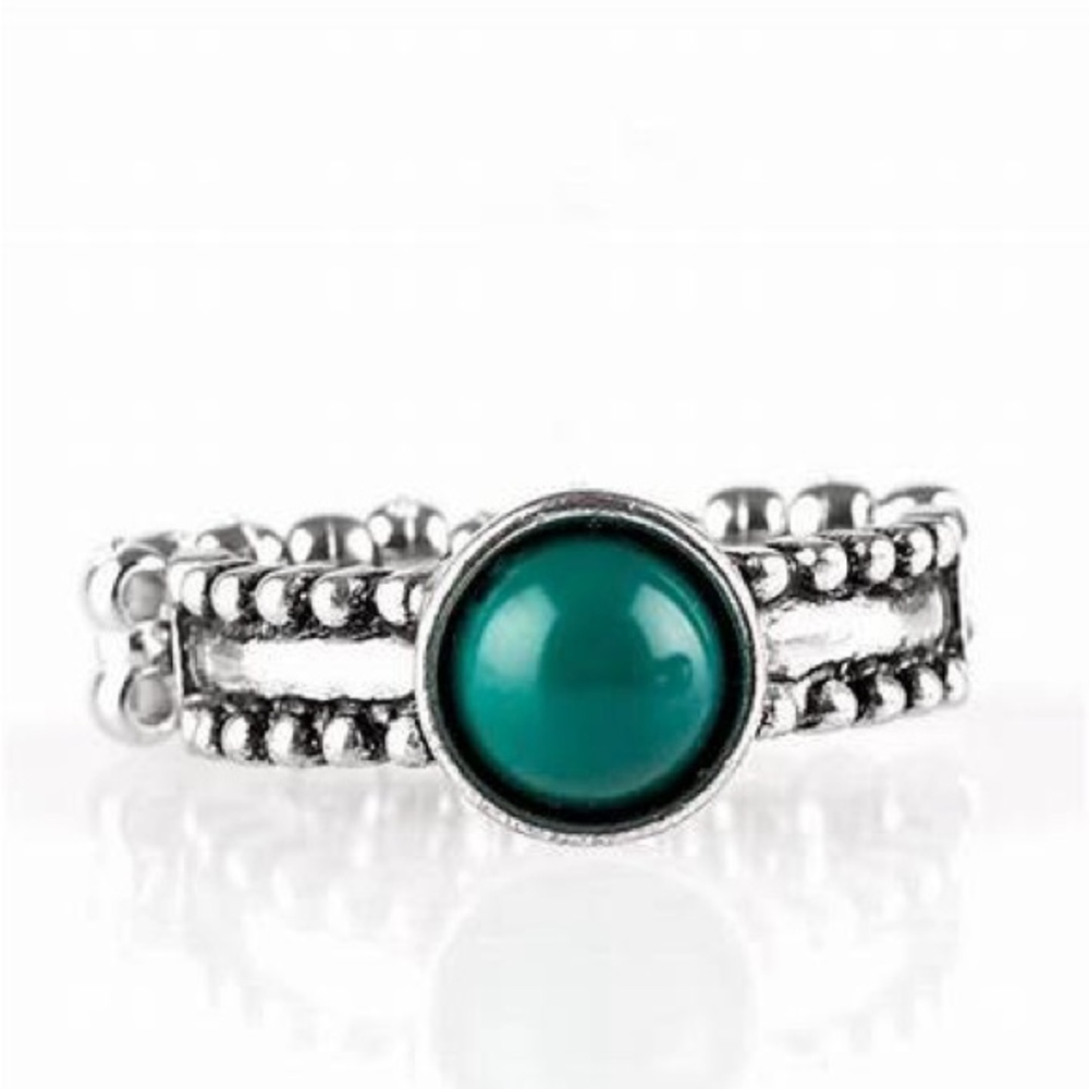 *Silver and green stone ring.